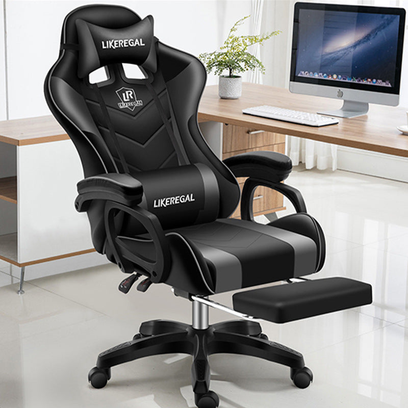 Modern office gaming chair in black with footrest and ergonomic design.